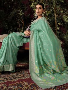 Introducing our exquisite "pretty teal green zari weaving silk festival wear saree with blouse" - the perfect outfit to make a statement at any festive occasion. This stunning teal-green silk saree features intricate sequin and embroidered work that adds a touch of elegance and charm to your look. Paired with a pink silk blouse with zari weaving work, this saree set is sure to turn heads wherever you go.
The 5.50-meter saree and unstitched blouse material allow for customization and a perfect fi Green Cutdana Traditional Wear For Eid, Green Slub Silk Set For Festivals, Green Slub Silk Traditional Wear For Wedding, Festive Green Slub Silk Traditional Wear, Green Cotton Silk Blouse With Dupatta, Green Cutdana Traditional Wear For Festive Season, Festive Green Cutdana Traditional Wear, Elegant Green Banarasi Silk Blouse Piece, Green Cotton Silk Blouse Piece With Dupatta