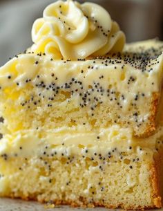 two slices of cake with white frosting and black sprinkles on top