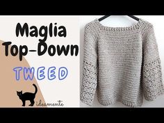 a crocheted sweater hanging on a hanger with the words top - down tweed