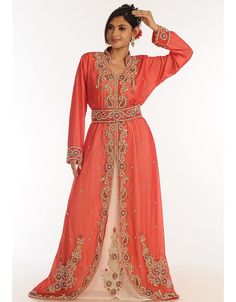 Peach Georgette Hand Zari Embroidery Party Wear Kaftan Right side and both sleeve zari work Back close with loop, button & zip, easy to wear Dress belongs to the zari embroidery work with glass stone at the front and sleeves Hijab and band shown in the image can be bought separately Fabric: GeorgetteCare: Mild machine wash/ hand Cold Wash/ Dry cleanWe request customers to carefully choose the correct size and dress length referring to our size chart Eid Floral Embroidered Kaftan For Reception, Eid Reception Kaftan With Floral Embroidery, Bollywood Style Festive Kaftan With Floral Embroidery, Festive Bollywood Kaftan With Floral Embroidery, Reception Kaftan With Zari Work For Diwali, Zari Work Kaftan For Diwali Reception, Pink Embroidered Traditional Kaftan, Traditional Embroidered Kaftan For Reception, Embroidered Traditional Drape Kaftan For Reception