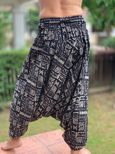 "⬇️ SHOP HERE https://www.etsy.com/ch-en/shop/IndycraftsDesigns Aladdin Pants, Harem Pants 100% Cotton Unisex pants, perfect for yoga, The pants have smock waist (wide bang elastic) The fabric is cotton soft, lightweight, and airy, ideal for those warm days. If it's a bit chilly, you could always wear leggings underneath. super comfortable cotton pants made of light, comfortable to wear cotton. The ideal pants for leisure, sport and wherever it should be loose and comfortable *Special features: Bohemian Baggy Pants With Tapered Leg, Cotton Trousers For Festivals, Traditional Bottoms With Pockets In Long Pants Style, Traditional Long Pants Bottoms With Pockets, Cotton Festival Trousers, Traditional Ankle-length Bottoms With Elastic Waistband, Traditional Baggy Long Pants Bottoms, Traditional Baggy Trousers, Traditional Baggy Long Pants