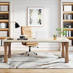 an office with a desk, chair and bookshelves