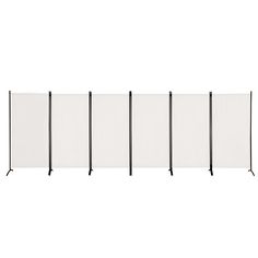 four white partitions are lined up against each other on a white background with black poles