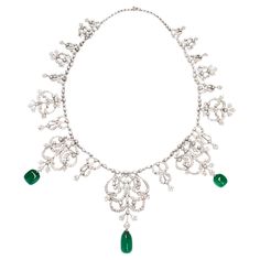 Rare Himalayan Mountain Emerald and Diamond convertible Tiara/Necklace A very beautiful and unique tiara that also converts into a necklace. It features 3 stunning GRS-certified natural emerald beads weighing a total of 27.05 carats, embellished with numerous white round brilliant diamonds weighing 12.27 carats. The emeralds, certified by GRS Lab as hailing from a specific part of the exotic Himalayan Mountains that traverse Afghanistan and Pakistan, are natural with only minor oil-based clarity Swedish Royal Tiaras, Elegant Formal Emerald Necklace With Intricate Design, Convertible Tiara, Unique Tiara, Emerald Tiara, Tiara Necklace, Himalayan Mountains, Necklace Emerald, Pearl Tiara