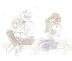 two people sitting on the ground with flowers in their hands and one holding a baby