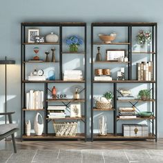 an open bookcase with many books and vases on it in a living room