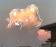 an image of a cloud that looks like a teddy bear with eyes and nose drawn on it