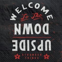 a welcome to the dorme dish towel with red and white lettering on black paper