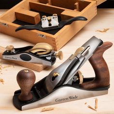 a pair of woodworking tools sitting on top of a table