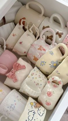 a drawer filled with lots of baby shoes