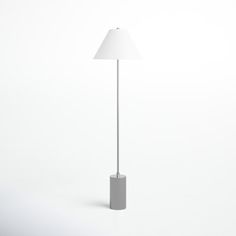 a floor lamp with a white shade on it's base and a light bulb in the middle