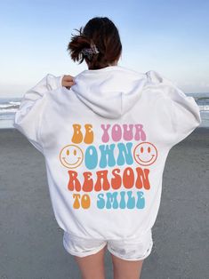 Be Your Own Reason To Smile  Hoodie ,Cute Hoodie, Aesthetic Hoodie ,Word's On Back Hoodie, Positivity Hoodie ,Tumblr Hoodie, Saying Hoodie A unisex heavy blend hooded sweatshirt is relaxation itself. The material is a thick blend of cotton and polyester. This makes for a plush, soft feel alongside warmth. It's also a great surface for printing. There are no side seams. A spacious kangaroo pocket hangs in front. The hood's drawstring is the same color as the base sweater.  .: 50% Cotton 50% Polye Fun Cotton Hoodie, Fun Cotton Hooded Hoodie, Funny Hooded Sweatshirt With Letter Print, Fun Hoodie With Letter Print For Streetwear, Funny Hooded Hoodie For Streetwear, Fun Letter Print Hoodie For Streetwear, Fun Graphic Print Hoodie, Fun Hooded Hoodie With Letter Print, Funny White Sweatshirt For Streetwear