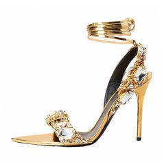 PRICES MAY VARY. Made of metallic patent leather, these gold heels for women are encrusted with sparkling crystals, which will add instant sparkle to any outfit. Sit atop a 4.72 inches high stiletto heel, get ready to show off your sassy side with these women’s stiletto high heel sandals. The insole is covered with smooth PU leather, with lightweight and slip-resistant rubber sole, these stilettos will allow you to take a comfy step outside. Highlights: Gold-tone, metallic sheen, decorative crys Sandals 2022 Trends, Gold Outfits, Sandals 2022, Rhinestone High Heels, Ankle Tie Sandals, Strappy Stilettos, Open Toe High Heels, Bridal Heels, Metallic Sandals