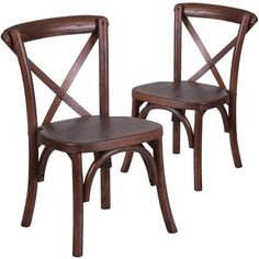 two wooden chairs sitting next to each other