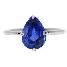 METAL SPECIFICATIONS White Gold 14K STONE SPECIFICATIONS Stone Name : Blue Sapphire Stone Cut : Pear Stone Details : There is one pear cut sapphire approx. 2.50 carats (Approx. Size 9 x 7 mm). Natural earth mined stone. Quality of Sapphire : AAA Total : Approx. 2.50 Carats RING SPECIFICATIONS Size : 6.5 (Can ship in any size, please send us a message about size after placing the order) Appraised Value : $7218.00 Comes with Certificate Blue Sapphire Pear-shaped Ring, Pear-shaped Sapphire Diamond Ring, Pear-shaped Blue Sapphire Ring, Teardrop Sapphire Ring With Diamond And Prong Setting, Pear Shaped Sapphire Rings For Anniversary, Pear-shaped Sapphire Ring, Sapphire Teardrop Ring With Prong Setting, Sapphire Pear Shaped Rings For Anniversary, Formal Teardrop Sapphire Ring With Prong Setting