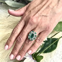 This One-of-a-Kind, Custom-Made Natural Emerald and Diamond Ring is a luxurious piece designed to captivate. Crafted in 14k gold, it showcases a finely faceted, high-quality natural emerald as the center stone, radiating deep green elegance and sophistication. The emerald is complemented by a stunning arrangement of brilliant diamonds that enhance its color and sparkle. Sized at 6.5 and resizable for a perfect fit, the ring has an impressive total carat weight (TCW) of 4.52 carats. Certified and Emerald Multi-stone Jewelry, Oval Multi-stone Emerald Ring In Platinum, Emerald-cut Multi-stone Diamond Emerald Ring, Emerald Cut Emerald Ring With Multi-stone Diamond, Anniversary Emerald Ring Fine Jewelry, Fine Jewelry Emerald Ring For Anniversary, Luxury Multi-stone Emerald Cut Emerald Ring, Oval Multi-stone Emerald Ring Fine Jewelry, Luxury Multi-stone Emerald Ring With Diamonds