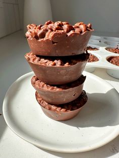 three chocolate cups stacked on top of each other