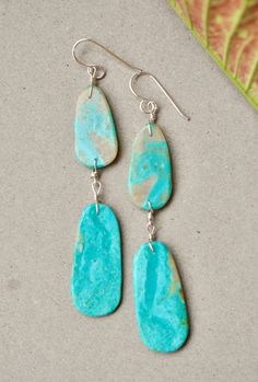 Native American double slab earring by artist Ronald Chavez Beautiful turquoise earrings with double slab. Gorgeous blue tones and soft matrix. Great pair of earrings by the talented Santo Domingo artist Ronald Chavez. Measurements : top slab : 1" X 0.5" bottom slab : 1 3/8" X 5/8" total length : 2 13/16" sterling silver turquoise Artsy Turquoise Nickel-free Earrings, Artsy Nickel-free Turquoise Earrings, Artistic Turquoise Jewelry With Matching Earrings, Artsy Turquoise Nickel-free Jewelry, Native American Jewelry, Blue Tones, Turquoise Earrings, Silver Turquoise, Turquoise Sterling Silver