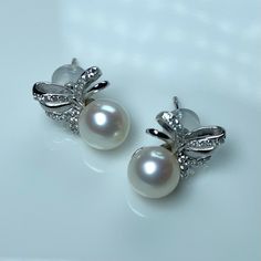 Pearls: freshwater  Shape: round Luster: mirror Grade: AAAAA Size: 7.5-8.5 Color: white with touch of pink Nacre: cored. Thick nacre. Stud: white/yellow gold plated 925 silver Pear-shaped Akoya Pearl Silver Earrings, Pearl White Akoya Pearl Earrings For Evening, Akoya Pearl White Pearl Earrings For Evening, White Pearl Drop Earrings For Evening, Pearl Earrings For Evening, Evening Akoya Pearl Earrings In Pearl White, Evening Akoya Pearl White Pearl Earrings, Evening White Pearl Drop Earrings, White Pearl Earrings With Pearl Charm For Evening