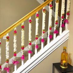 the banisters are decorated with pink and white decorations