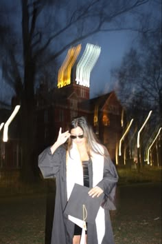 a woman dressed as a nun outside at night