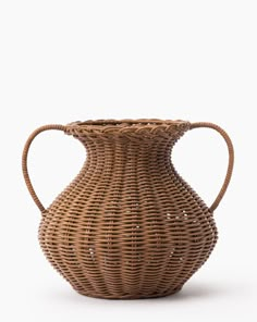 a wicker vase is shown against a white background