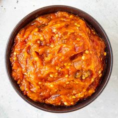 a bowl filled with chili and beans on top of a table