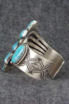 This stunning and substantial Kingman turquoise and sterling silver bracelet was made by Navajo silversmith Calvin Martinez. The inside is signed C MTZ, Navajo and stamped sterling.Size: 5 1/2" (will fit up to a 6 3/4" wrist)Gap: 1 1/4"Length: 2 3/4"Free shipping on all orders! We ship with USPS and always include tracking. All orders ship within a day of payment.Returns are accepted up to 30 days after you receive your order. Just send us a message. Our shop offers cash back or store credit. Th Luxury Kingman Turquoise Sterling Silver Bracelet Gift, Luxury Blue Kingman Turquoise Sterling Silver Bracelet, Cuff Bangles, Arm Candy, Sterling Silver Bracelets