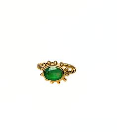 The silver ring with a green beryl and an 18-carat gold coating from Moss Jewellery is an exquisite piece of jewelry that seamlessly blends elegance with the beauty of nature. At the heart of this accessory is a green beryl stone, radiating a mesmerizing sparkle and boasting an intense, deep shade of green. This precious gem symbolizes natural beauty and serves as an emblem of harmony and inner balance. The surrounding silver band delicately frames the beryl, creating a sophisticated contrast and lending the ring an understated yet refined appearance. The 18-carat gold coating, executed with state-of-the-art techniques, adds a touch of luxury and brilliance, elevating the overall elegance of the piece. The design of this ring reflects inspiration drawn from nature, aiming to create unique Cabochon Emerald Ring Gift, Unique Emerald Ring For May Birthstone, Gift Cabochon Emerald Ring, Tsavorite May Birthstone Ring, Green Birthstone Ring With Bezel Setting, Green Birthstone Ring With Bezel Setting, Open Design, Green Birthstone Ring With Bezel Setting And Open Shape, Unique Oval Emerald Ring, Fine Jewelry Emerald Ring With Stone Setting