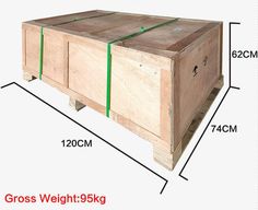 a large wooden box sitting on top of a white floor next to a measuring line