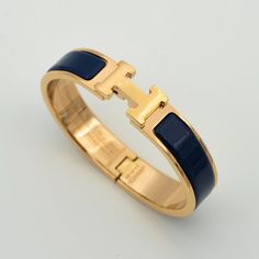 H BLUE BRACELET Designer Blue Bracelet Jewelry, Elegant Blue Cuff Bracelet With Polished Finish, Formal Blue Bracelet With Polished Finish, Blue Bracelets With Polished Finish For Formal Occasions, Elegant Adjustable Blue Cuff Bracelet, Elegant Blue Adjustable Gold Bracelet, Elegant Adjustable Blue Gold Bracelet, Classic Blue Bracelet Jewelry, Elegant Blue Cuff Bracelet For Gift