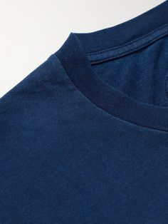 The traditional techniques Blue Blue Japan uses gives its pieces a distinct feel that's hard to replicate, this cotton-jersey T-shirt is hand-dyed with the brand's signature indigo. Pair it with chinos or shorts. Small to size. See Size & Fit notes. Blue Washed Relaxed Fit T-shirt, Blue Washed Cotton Tops, Blue Cotton Soft-washed Top, Blue Washed Cotton Top, Washed Blue Cotton T-shirt, Indigo Cotton Short Sleeve T-shirt, Washed Blue Cotton Crew Neck T-shirt, Soft-washed Blue Cotton Top, Denim Blue Washed Cotton Top