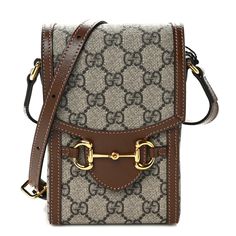 This is an authentic GUCCI GG Supreme Monogram Mini Horsebit 1955 Crossbody Bag in Beige and Brown Sugar. This shoulder bag is crafted of Gucci monogram coated canvas in brown with brown leather trim. The bag features an adjustable leather shoulder strap and a gold horse-bit detail on the front to secure the flap closed. This opens to a beige microfiber interior. Gucci Crossbody Bag, Gold Horse, Gucci Crossbody, Small Messenger Bag, Gucci Monogram, Vintage Monogram, Horse Bits, Gucci Shoulder Bag, Monogram Bag