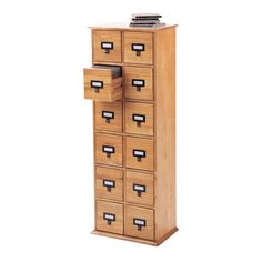 a tall wooden cabinet with many drawers