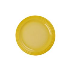 an empty yellow plate on a white background