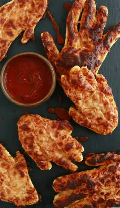 fried chicken wings with ketchup and sauce on the side, ready to be eaten