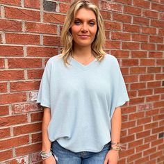 Introducing our chic and contemporary women's fashion top, where style meets comfort effortlessly. The cocoon sleeves add a modern twist, offering a relaxed yet flattering silhouette that drapes beautifully. Whether you're heading to a brunch date or a casual evening out, this versatile piece effortlessly transitions from day to night. Pair it with your favorite jeans for a laid-back vibe, or dress it up for a polished look. Palmetto Moon, Fall Faves, Southern Women, Brunch Date, Casual Evening, Beach Essentials, Brand Sale, Simply Southern, Fashion Top