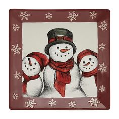 two snowmen are standing next to each other on a red and white frame with snowflakes