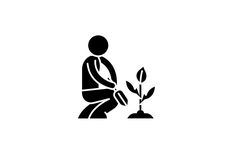 a person kneeling down next to a plant with a sprout growing from it