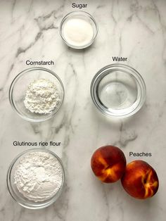 ingredients to make peach cobble laid out on a marble counter top