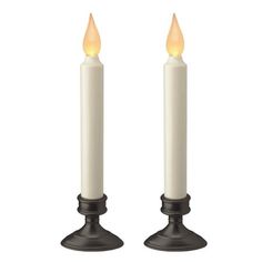 two white candles sitting side by side on top of each other with one candle lit