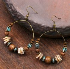 Colorful Beaded Brown Earrings For Beach, Beach Beaded Earrings With Colorful Beads, Brown Beaded Earrings For The Beach, Handmade Vintage Hoop Earrings For Summer, Bohemian Brown Beaded Round Earrings, Bohemian Brown Round Earrings, Brown Bohemian Round Earrings, Beaded Earrings With Ear Wire For Beach, Adjustable Beaded Earrings With Ear Wire For Beach