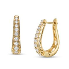 Add sparkle to any look with these eye-catching 1 ct. t.w. diamond hoop earrings. Created in warm 10K gold Each oval-shaped hoop features a row of diamonds sparkling along the tapered front edge. These earrings secure with hinged backs. Jewelry Design Drawing, Buying Diamonds, San Andreas, Diamond Hoop Earrings, Design Drawing, Gold Jewelry Fashion, Cute Earrings, 10k Gold, Designs To Draw