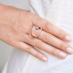 This stylish cocktail ring features a unique and distinctive design. The contemporary shape makes a strong statement adding style and sophistication to every look. The ring is set in 18ct Rose Gold Vermeil on Sterling Silver with a lovely multifaceted Blue Topaz gemstone as a centrepiece. The versatile ring can be worn both with day and evening wear.This original designer piece has been handcrafted by our artisan craftsmen using only the finest precious metals. We only work with natural semi-pre Rose Gold Cocktail, Ring Trends, Gold Cocktail Ring, Gold Cocktail, Gold Bangles Design, Bangle Designs, Ring Blue, Geometric Jewelry, Emerald Jewelry