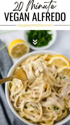 a spoon full of vegan alfredo with lemons and parsley