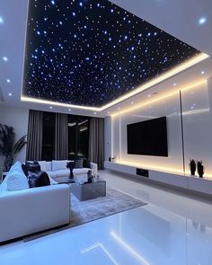 a living room filled with white furniture and stars on the ceiling