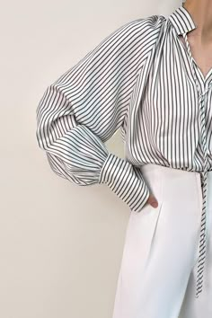 1.Product Details Size runs small，recommend one size up This blouse is ideal for wearing from desk to dinner. It’s shaped for a loose and lightweight fit with vertical stripes throughout(in olive color), a split high neck with self tie detail, and long cuffed sleeves. Style it with tailored pants for social occasions or pare it back with jeans for a dinner date. Fit Type: Regular Fit How it Fits: No Stretch Fabric: 96% Polyester, 4% Spandex Care Instructions: 1.Machine Wash at or below 30°C 2.Do not bleach 3.Line dry in shade 4.Iron cool (max 110â„? 5.Dry clean, tetrachloroethylene(PCE) only Please note: The images represent actual product though color of the image and product may slightly differ. 2.How To Measure It Model is wearing: M SKU: 2203AA0646GHXSSKU: ${data.sku} Wedding Tops, Retro Blouse, Lawyer Fashion, Lantern Sleeved Blouses, Stripe Blouse, Jacquard Shirt, Blouse Lace, Bridal Separates, Fitted Turtleneck