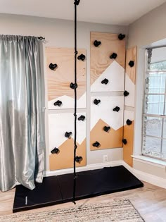 a room with some wooden boards on the wall and a rug in front of it