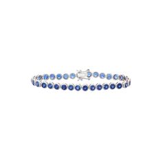 Lab-created sapphire gemstones give this sterling silver tennis bracelet alluring appeal.BRACELET DETAILSLength: 7.25 in. Clasp: boxMetal: rhodium-plated sterling silverSTONE DETAILSStone type: lab-created sapphireTotal weight: 8 1/2 ct. Shape: roundSetting: bezel Size: 7.25". Color: Blue. Gender: female. Age Group: adult. Sapphire Tennis Bracelet Fine Jewelry With Prong Setting, Sapphire Tennis Bracelet With 17 Jewels, Classic Sapphire Tennis Bracelet With Prong Setting, Classic Sapphire Tennis Bracelet With Round Shape, Sapphire Tennis Bracelet With Jubilee Design, Classic Sapphire Tennis Bracelet With Brilliant Cut, Blue Round Tennis Bracelet With Prong Setting, Blue Tennis Bracelet With Prong Setting, Classic Sapphire Gemstone Tennis Bracelet