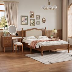 a bed room with a neatly made bed next to a dresser and mirror on the wall